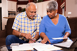 couple going over bills to be paid