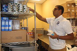 man stocking up inventory at donation site