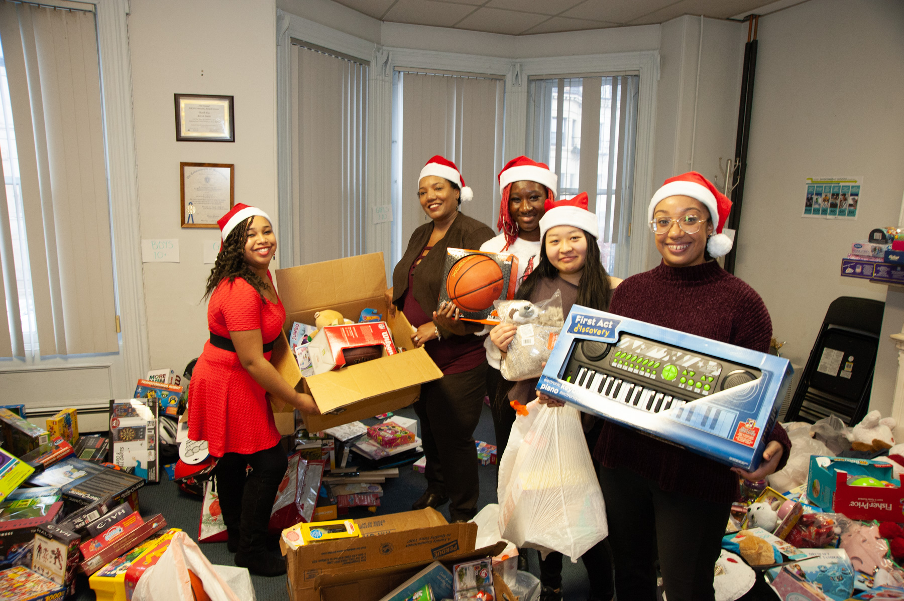 ABCD South End staff and volunteers give toys to neighborhood kids in need through toy drive